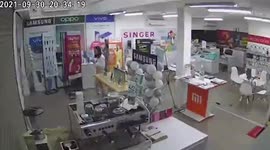 Escaped buffalo smashes into phone shop knocking over female assistant in Thailand