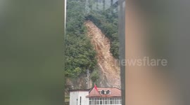 Pylon crashes down mountain during landslide, causing power outage in northern China