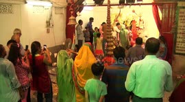 This Baba Balances 21 Pots On Stomach To Worship Goddess Durga for world peace in Northern India
