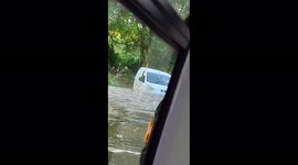 'It's coming through!' Passengers gasp as shuttle bus attempts to drive through submerged road in Essex, UK