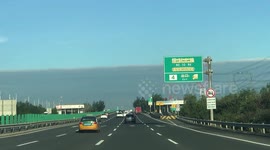 Clouds and clear sky separated by 'straight line' in Beijing