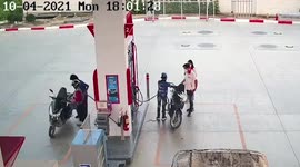 Cobra snake emerges from motorcycle and leaps at petrol station pump attendant