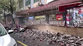 Huge billboard falls off shopfront damaging parked vehicles in eastern China