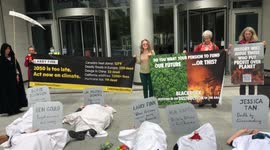 Eco-activists hold “die-in” protest outside Black Rock in London