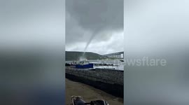 Large waterspout swirls out at sea in southern China