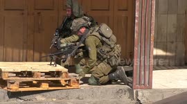 Palestinian protesters hurl stones at Israeli troops in clashes in Hebron in the West Bank