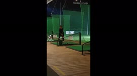 10 year old kid golfer with perfect strike practicing swing on golf range