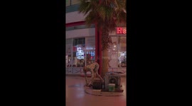 Tall lanky and flexible guy folds himself into a small box on the streets of Las Vegas Nevada