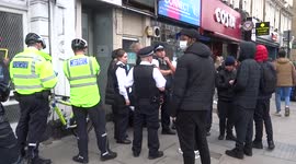 Metropolitan Police question a group of youngsters in Earls Court - London