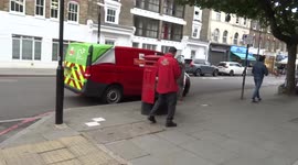 Royal Mail postie forgets a set of keys inside red mail box on Pentonville Road in King's Cross - London