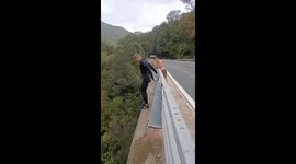 Young man does huge 26m jump from a bridge in Corsica, France