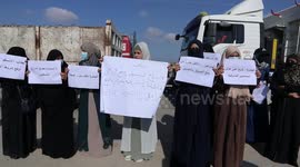 Palestinian farmers and traders take part in a protest against Israeli authorities a new restriction on them in front of the Kerem Shalom crossing