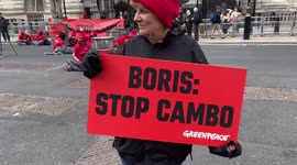 Greenpeace activists lock themselves to barrels outside Downing Street in protest against the Cambo oil field, London, UK 11/10/2021