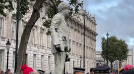 Greenpeace activists erect Boris Johnson statue in front of Downing Street during protest