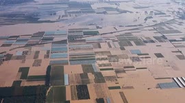 Thousands of residents evacuate as flash floods submerge city in northern China