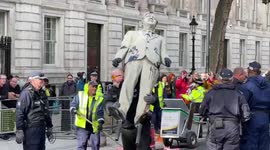 Police remove tar-covered statue of Boris Johnson erected by Greenpeace protesters