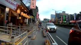PARKING FAIL: Pedestrian casually watches as a driver continues to reverse until they bump into another car
