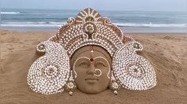 Beautiful sand art installation of Maa Durga by Sea shells at Puri beach