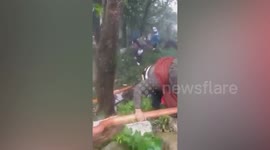 Tourists rescued after Tropical Cyclone Kompasu triggers landslide in the Philippines