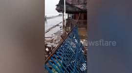 Beachfront hotel damaged, garbage washed ashore in the Philippines due to Kompasu