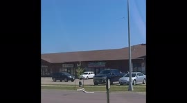 Man walks into Mr Money store and robs them. Store employee gives chase and fires 7 rounds into back window