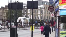 White double-decker bus with No Time To Die advertising spotted in Kings Cross - London