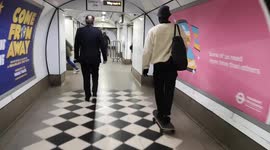 A Skateboarder Skates Through Holborn Underground Station In London