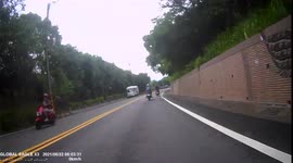 CLOSE CALL: Car illegally overtakes and almost causes head-on collision with a moped rider in Taiwan (Dashcam Video)