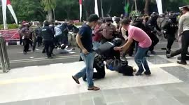Horrifying moment cop BODYSLAMS protester instantly knocking him out at rally in Indonesia