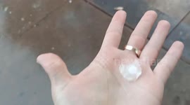 Pedestrians sprint for cover as Sydney area battered by huge hailstorm