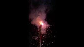 CLOSE SLOW MOTION CAUGHT OF A TWO ROCKET FIREWORKS BEING LAUNCHED