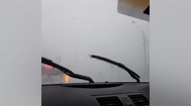 Car stuck in hailstorm as severe weather batters Australia