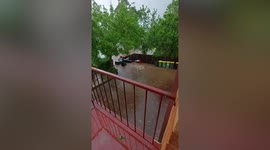 Sydney storm flood washes away trash bins in Sydney