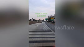 Motorist's voice shakes as he drives over 100-metre-long road with dozens of speed bumps in China
