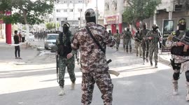 Palestinian militants from the Al-Quds Brigades, the armed wing of the Islamic Jihad movement, take part in a military parade, in support of prisoners held in Israeli jails