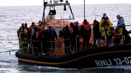 Dozens of migrants land on beach in Dungeness, Kent escorted by border forces