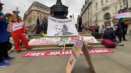 Julian Assange supporters stage protest in London’s Piccadilly Circus ahead of final extradition hearing
