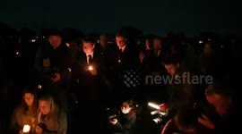 Sir David Amess: Mourners kneel next to candles at Leigh-On-Sea vigil