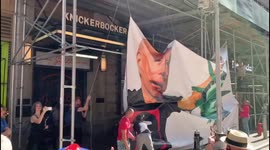 Banner depicting Biden holding decapitated head of Statue of Liberty unfolded as nearly 1,000 protesters gather in New York against COVID-19 vaccine mandates