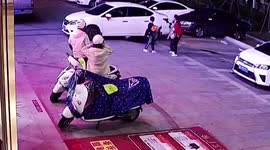Mum's superhuman reflexes pull son out of way of reversing car in China