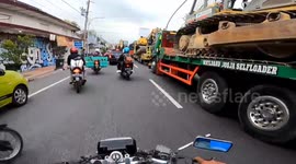 Two scooter riders crash, go head over handlebars in Indonesia after one rider ignores red light