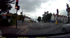 Dash Cam footage of crazy driver doing u-turn at a junction and nearly causing a crash