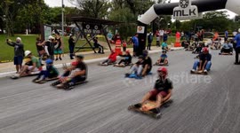 Parents and kids take part in cart race down streets of Sao Paulo, Brazil