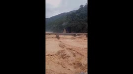 Flash floods see swollen river batter bridge in central Vietnam