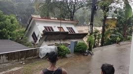Indian locals watch on helplessly as house collapses into river during deadly Kerala floods