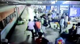 India security personnel save pregnant women from falling into the gap between the train and the platform in western india.