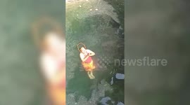 Police official performs yoga in water in central India