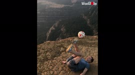 Don't lose the ball! Talented football freestyler shows off cool tricks at mountaintop