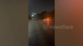 Driver rescued after car gets swept away in floods in Thailand