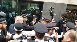 MP Michael Gove is ambushed by anti-vaccine passport protesters during walk around Westminster in London